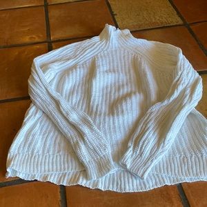 White Gap cable knit sweater.